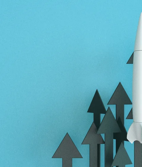 A rocket ship facing upward with upward facing arrows, representing the evolution of brand marketing