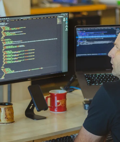 web developer looking at code on his computer