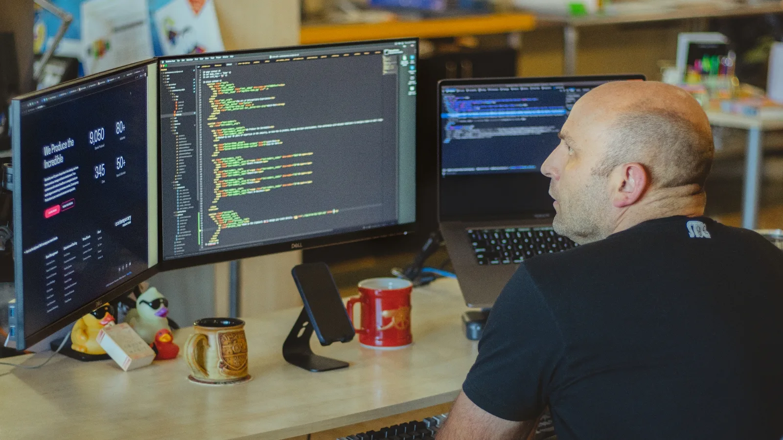 web developer looking at code on his computer