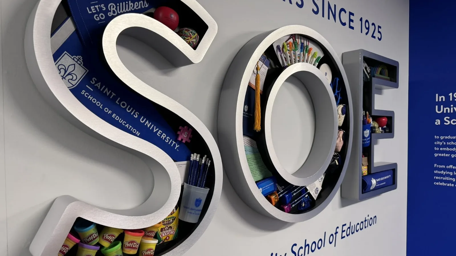 3D rendering of the letters SOE with school supplies inside the letters.