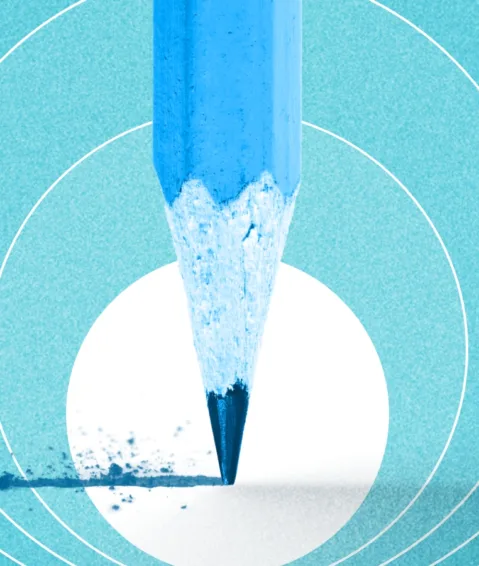 a pencil drawing a line across a page on a blue background