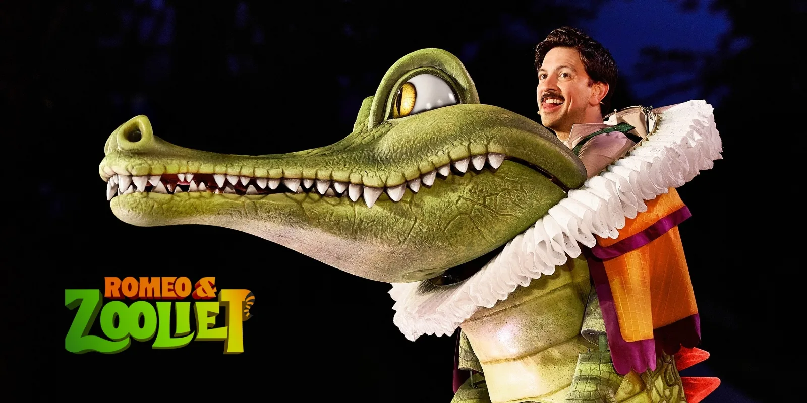 large crocodile puppet with puppeteer next to Romeo and Zooliet Logo