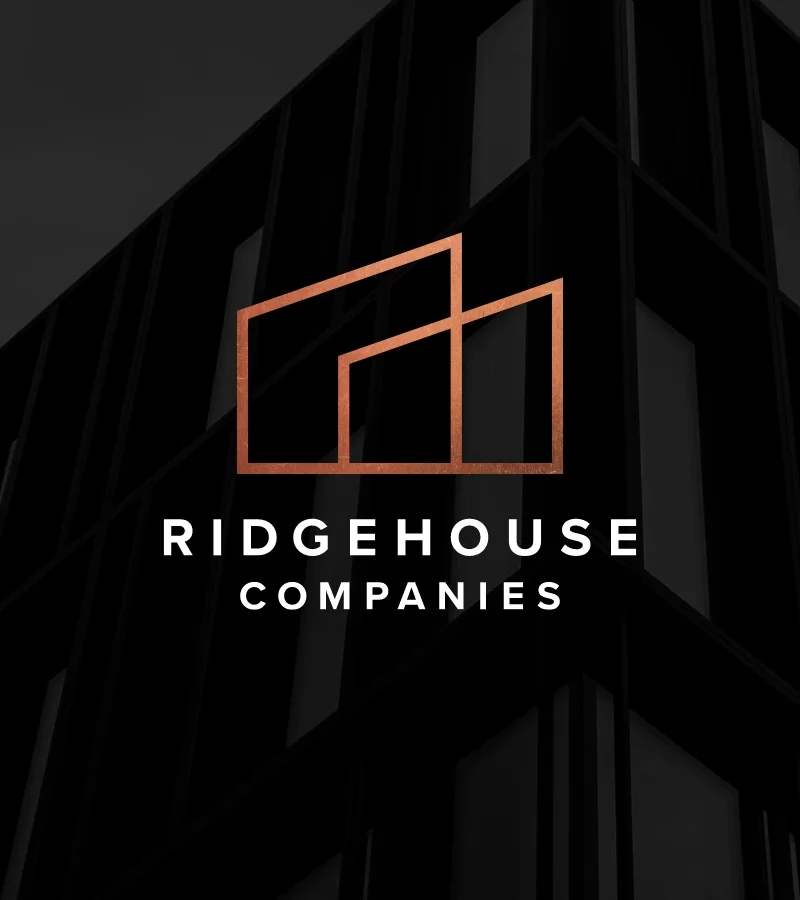 Ridgehouse Logo centered atop a silhouette of a tall building