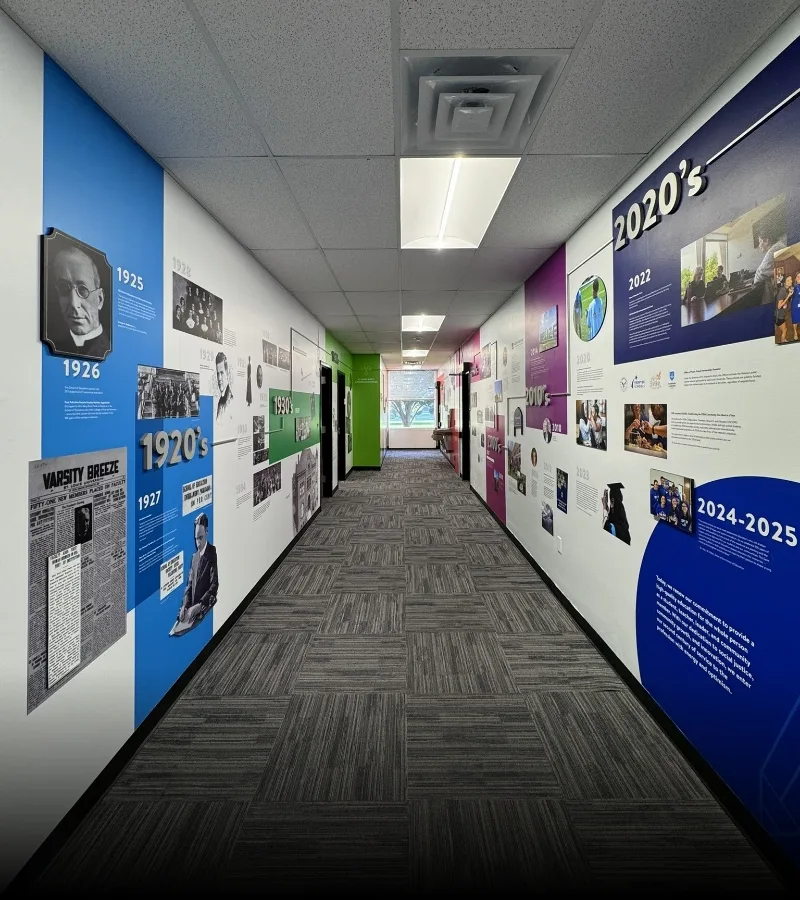 hallway with colorful timeline graphics from floor to ceiling.