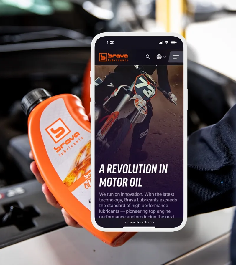 Mobile phone with homescreen shown atop of an image of a mechanic holding a brava oil bottle