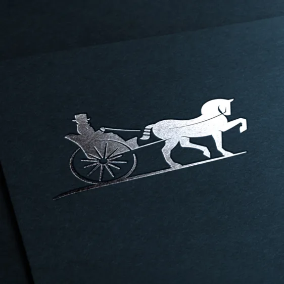 A metallic silver horse-and-carriage logo stamped on textured dark navy paper.