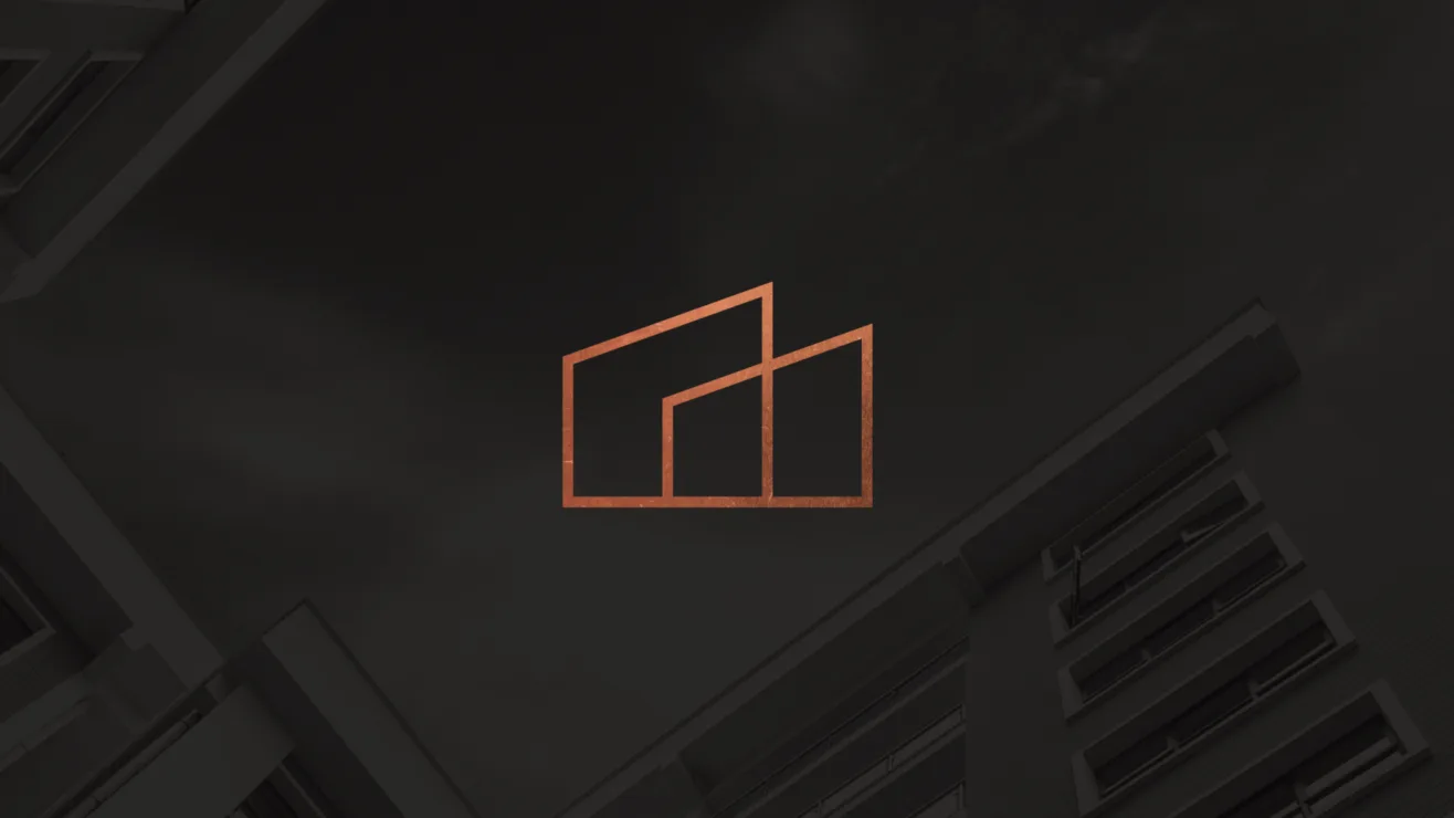 A metallic copper building-outline logo centered against a dark grey architectural background.