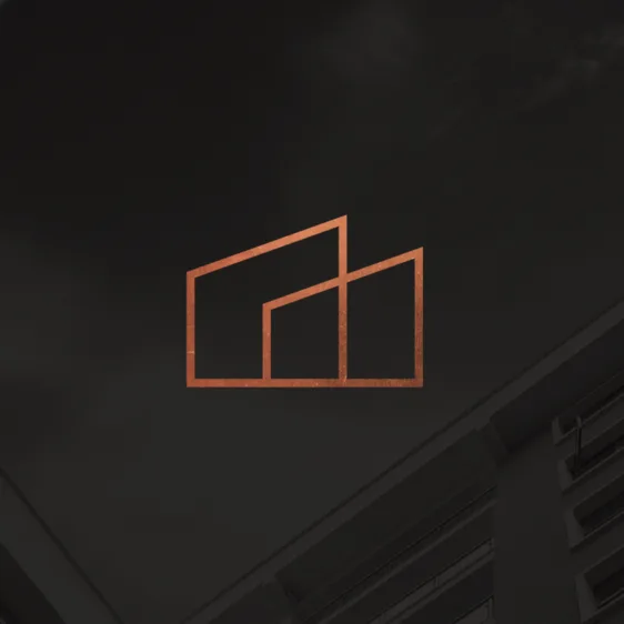 A metallic copper building-outline logo centered against a dark grey architectural background.